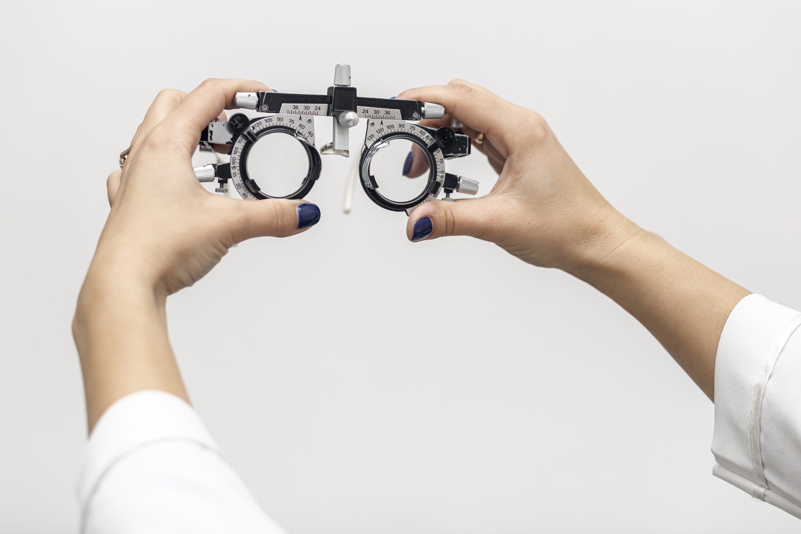 front-view-woman-holding-up-optics-equipment